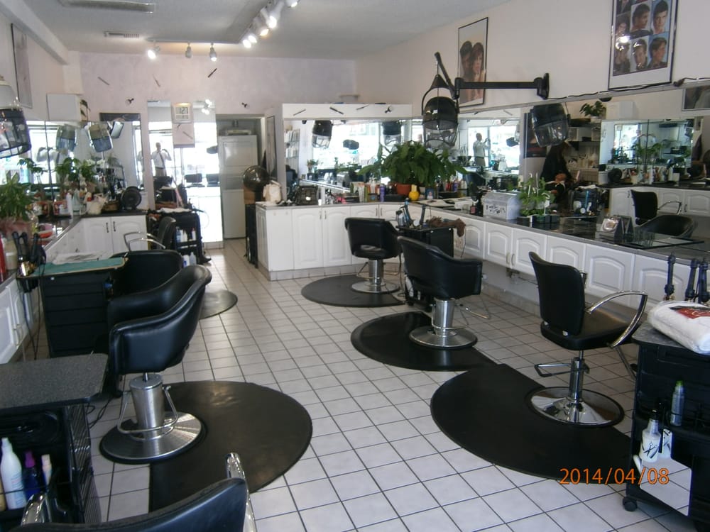 Empty hair salon with chairs and mirrors